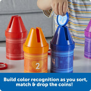 Child placing a colour coin into a Counting Crayons toy