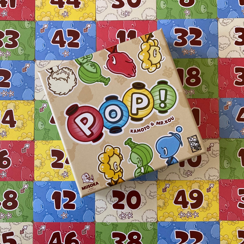 Musoka Pop! box surrounded by colourful numbered cards